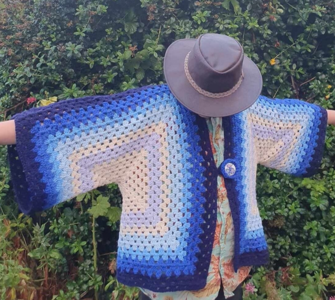 Cool in blue crochet cardigan.